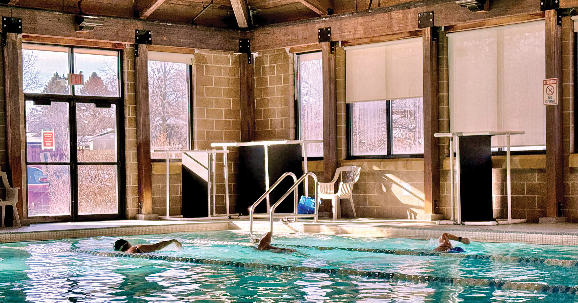 People swimming laps in the pool