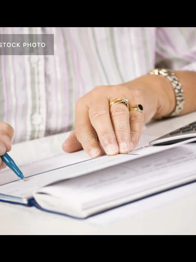 woman writing check
