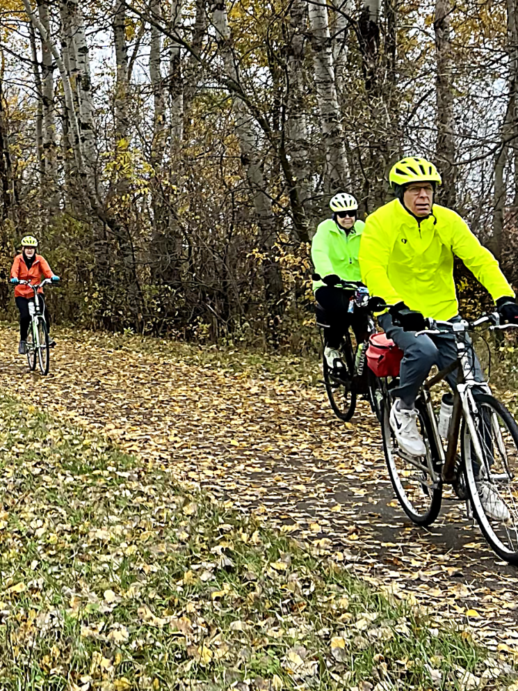 Bikers on a trail in fall