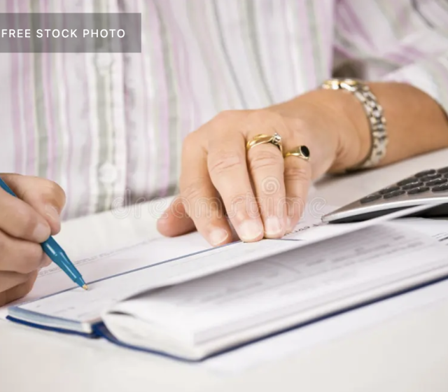woman writing check