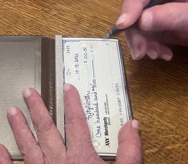 Someone making a donation to FiftyNorth