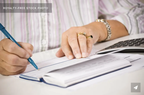 woman writing check