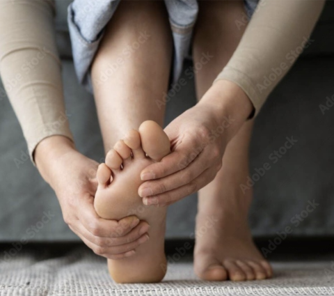 Hands massaging a foot